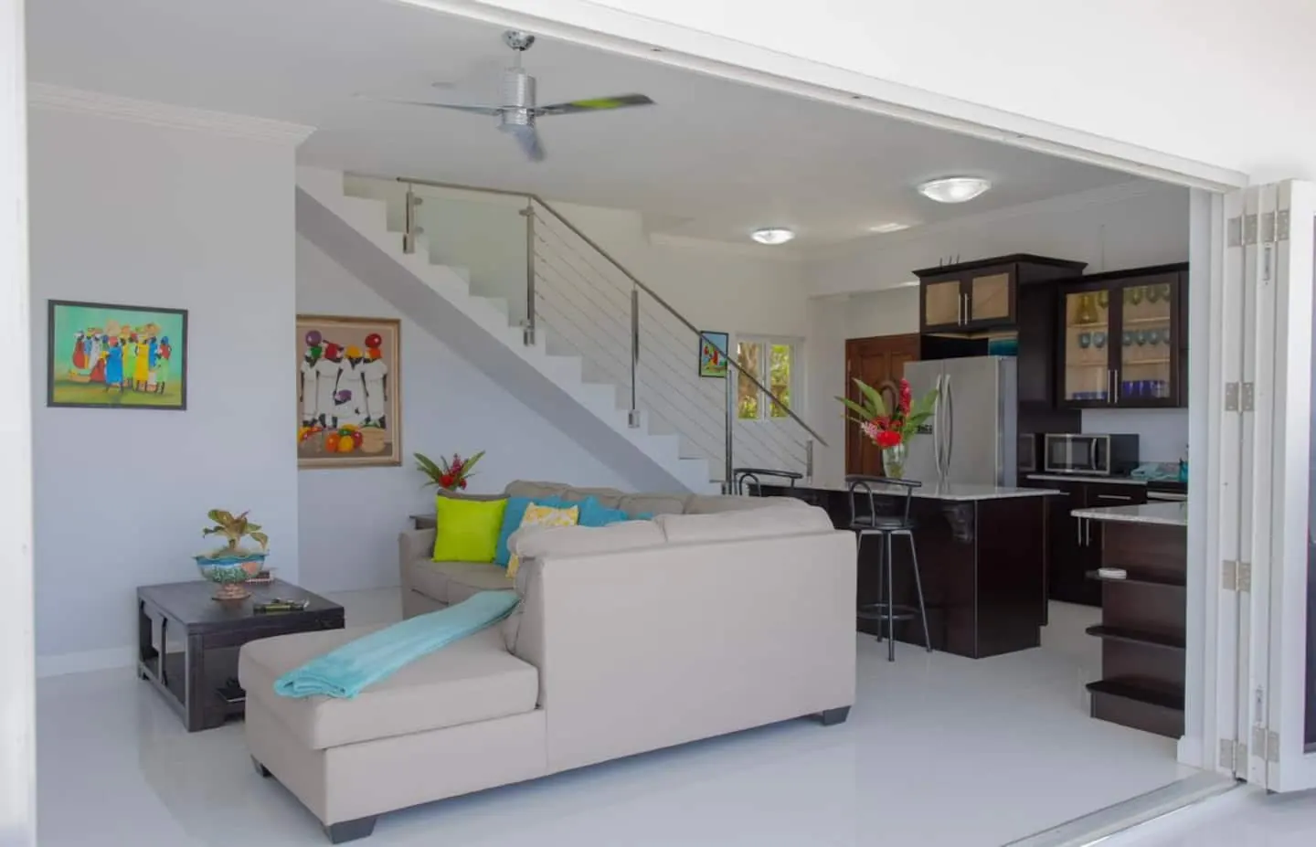 Open-plan living room and kitchen, with stairs to the upper floor.